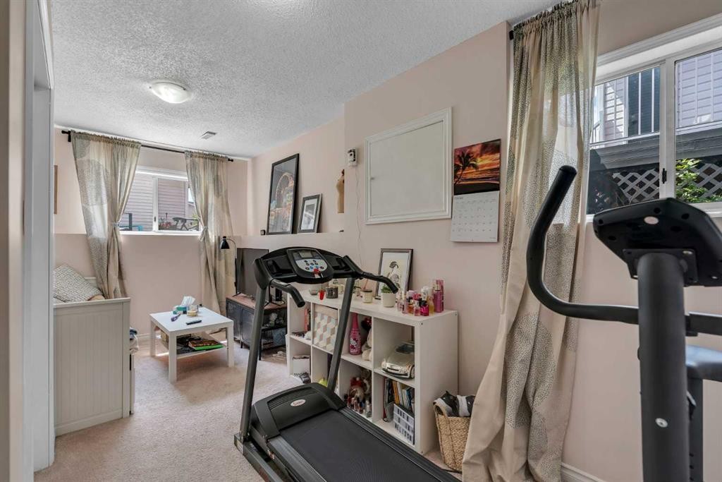 43 Covington Rise Ne, Calgary, AB - Indoor Photo Showing Gym Room