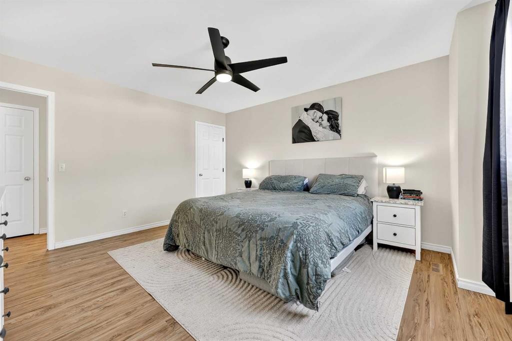 250 Cimarron Boulevard, Okotoks, AB - Indoor Photo Showing Bedroom