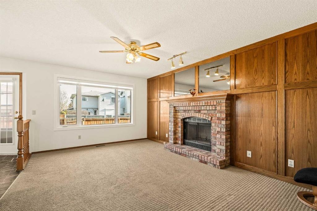 224 Eldorado Place Ne, Calgary, AB - Indoor Photo Showing Living Room With Fireplace