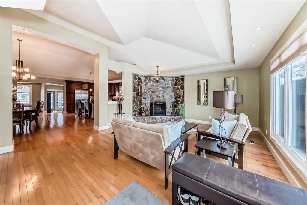 36 Dalrymple Green Nw, Calgary, AB - Indoor Photo Showing Living Room With Fireplace