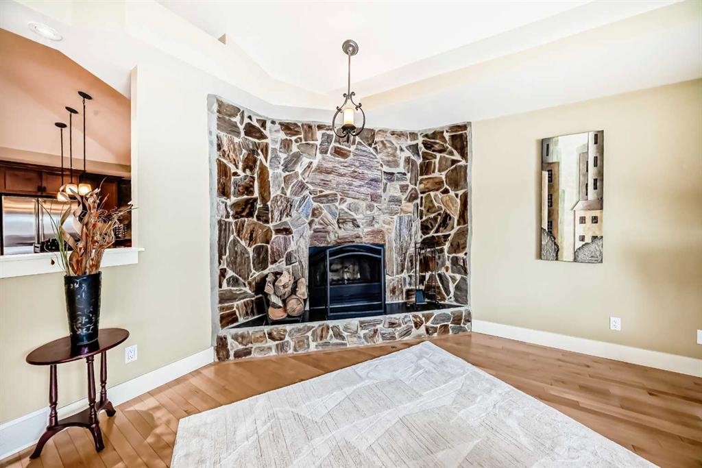 36 Dalrymple Green Nw, Calgary, AB - Indoor Photo Showing Living Room With Fireplace