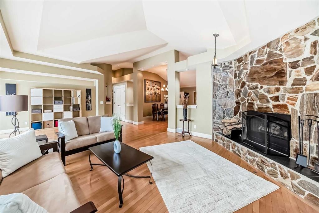 36 Dalrymple Green Nw, Calgary, AB - Indoor Photo Showing Living Room With Fireplace