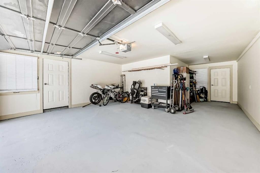36 Dalrymple Green Nw, Calgary, AB - Indoor Photo Showing Garage