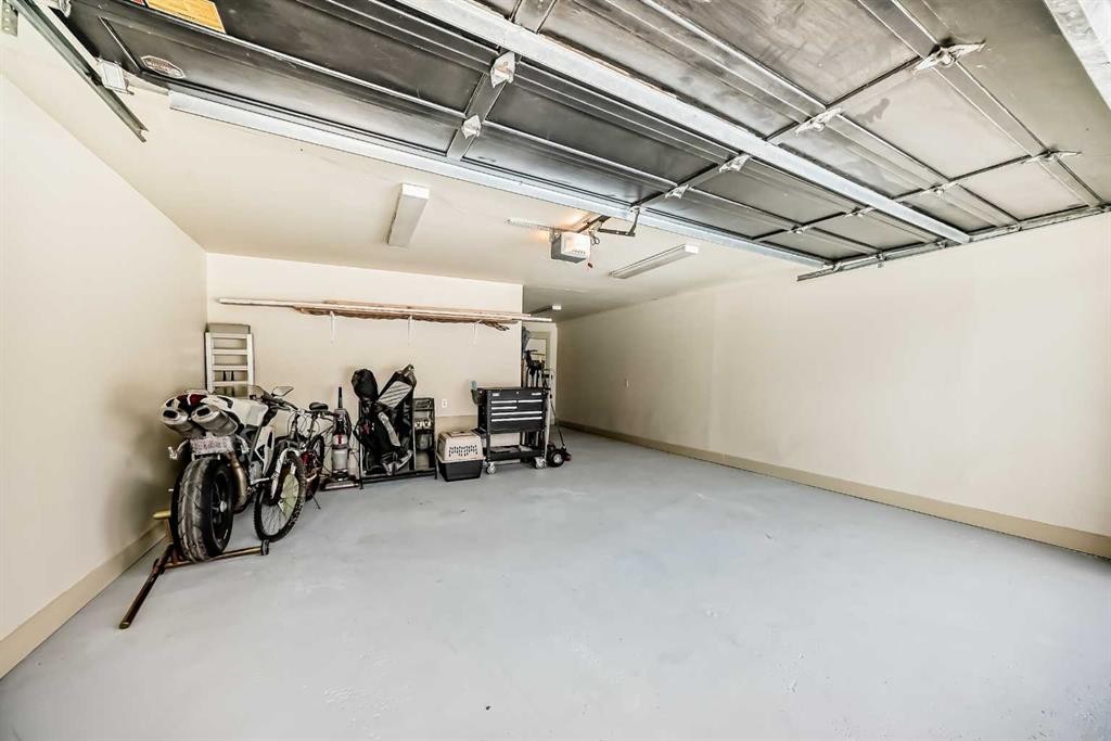 36 Dalrymple Green Nw, Calgary, AB - Indoor Photo Showing Garage