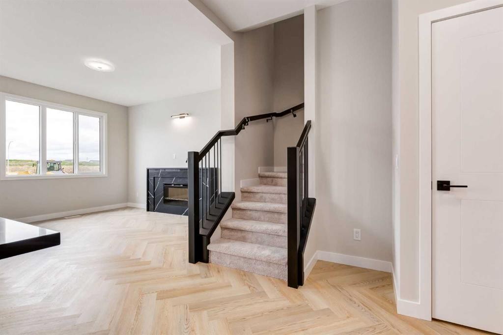 178 Greystone Boulevard, Cochrane, AB - Indoor Photo Showing Other Room With Fireplace