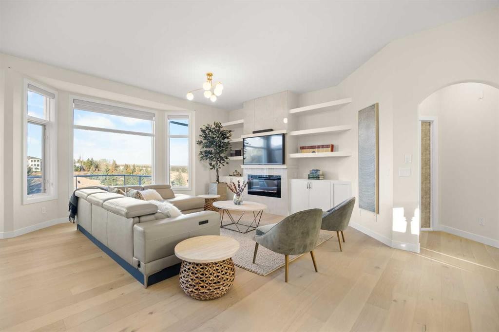 271 Hamptons Terrace Nw, Calgary, AB - Indoor Photo Showing Living Room With Fireplace
