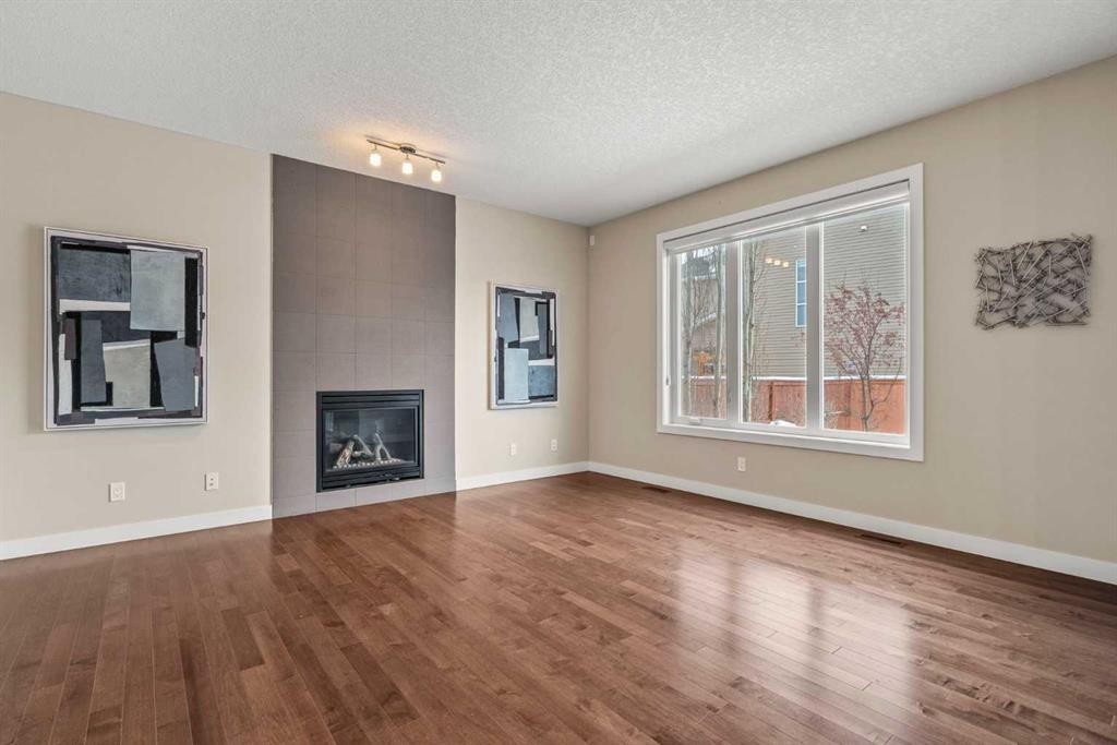 2306 Bayside Circle Sw, Airdrie, AB - Indoor Photo Showing Living Room With Fireplace