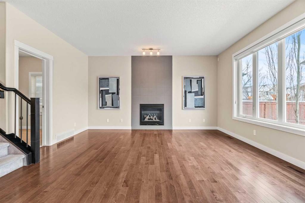 2306 Bayside Circle Sw, Airdrie, AB - Indoor With Fireplace