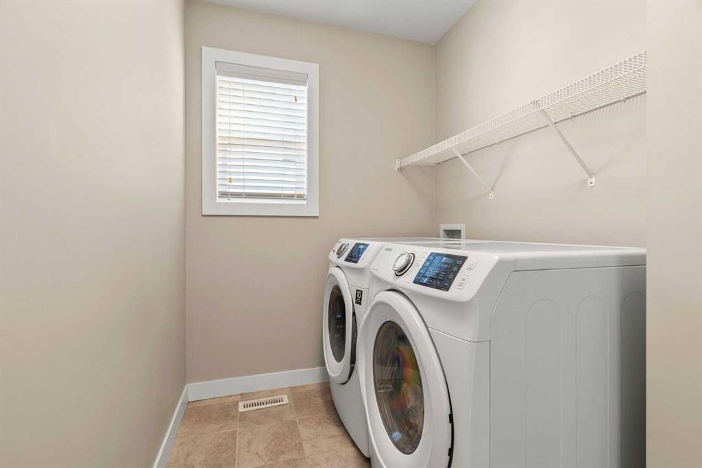 2306 Bayside Circle Sw, Airdrie, AB - Indoor Photo Showing Laundry Room