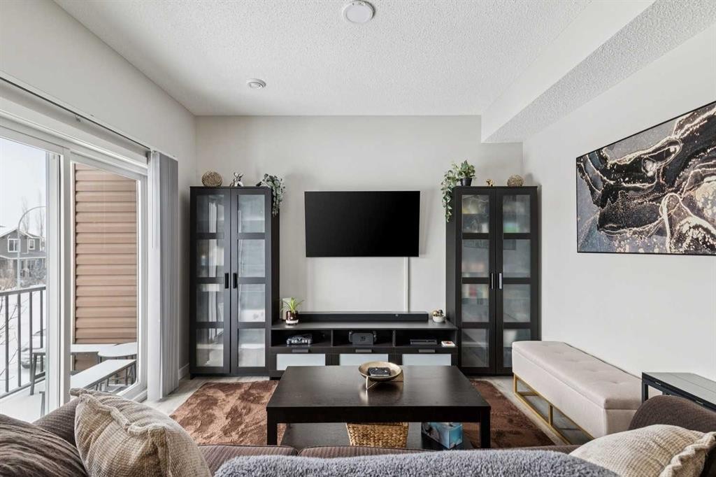 1009-250 Fireside View, Cochrane, AB - Indoor Photo Showing Living Room