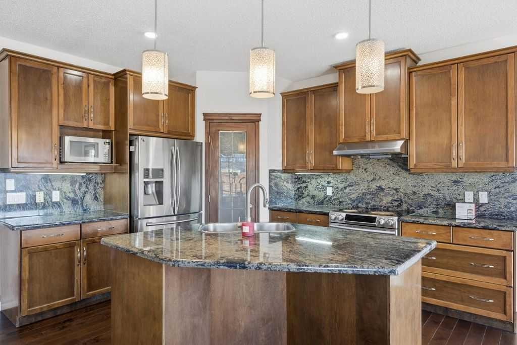 106 New Brighton Circle Se, Calgary, AB - Indoor Photo Showing Kitchen With Double Sink