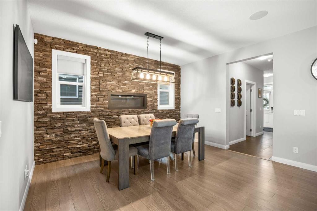 40 Evansfield Place Nw, Calgary, AB - Indoor Photo Showing Dining Room With Fireplace