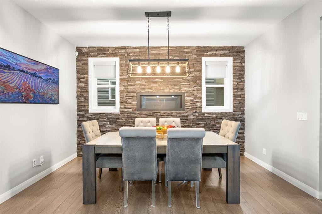 40 Evansfield Place Nw, Calgary, AB - Indoor Photo Showing Dining Room With Fireplace