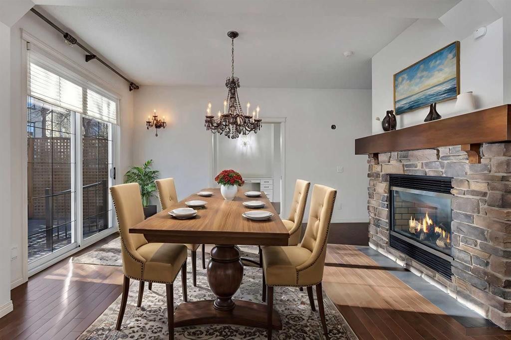 218 Valley Woods Place Nw, Calgary, AB - Indoor Photo Showing Dining Room With Fireplace