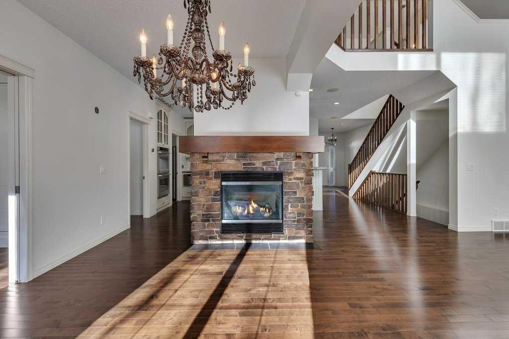 218 Valley Woods Place Nw, Calgary, AB - Indoor Photo Showing Living Room With Fireplace
