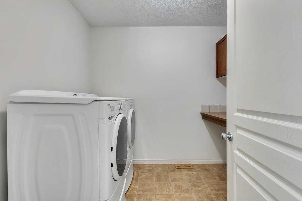 218 Valley Woods Place Nw, Calgary, AB - Indoor Photo Showing Laundry Room