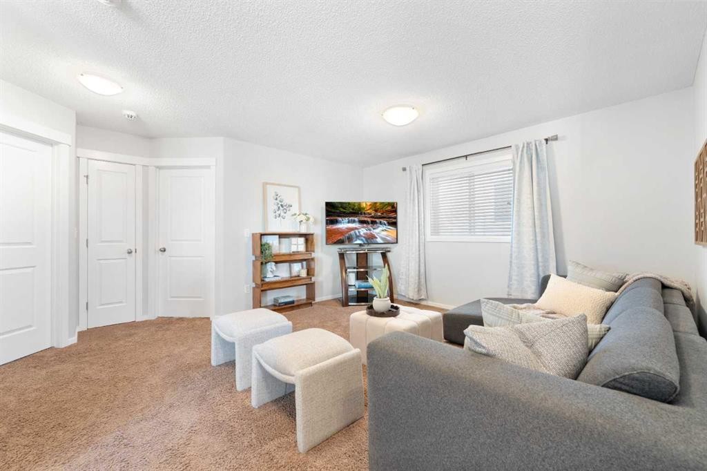 295 Prairie Springs Crescent Sw, Airdrie, AB - Indoor Photo Showing Living Room