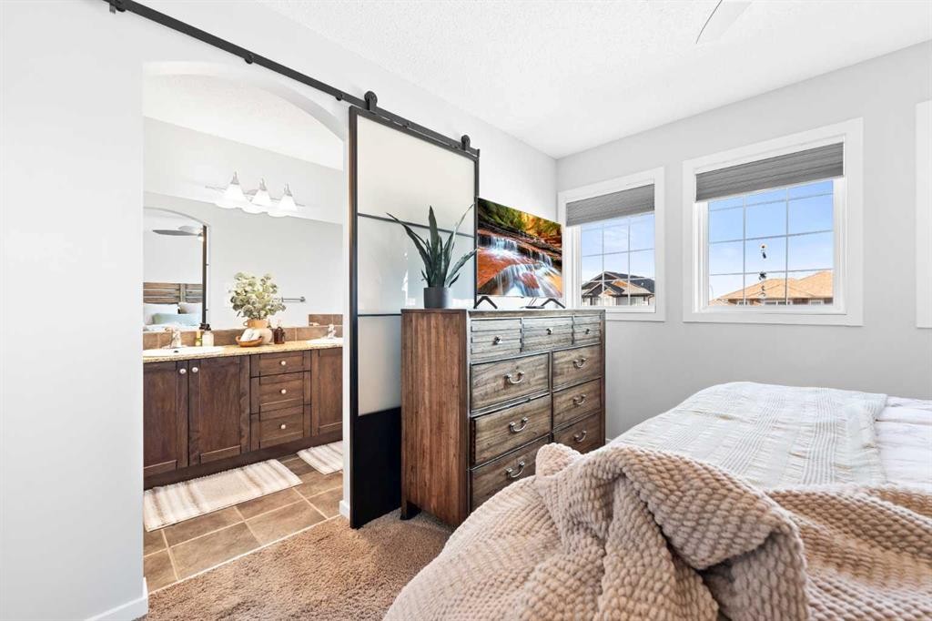 295 Prairie Springs Crescent Sw, Airdrie, AB - Indoor Photo Showing Bedroom