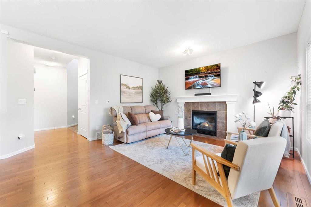 295 Prairie Springs Crescent Sw, Airdrie, AB - Indoor Photo Showing Living Room With Fireplace