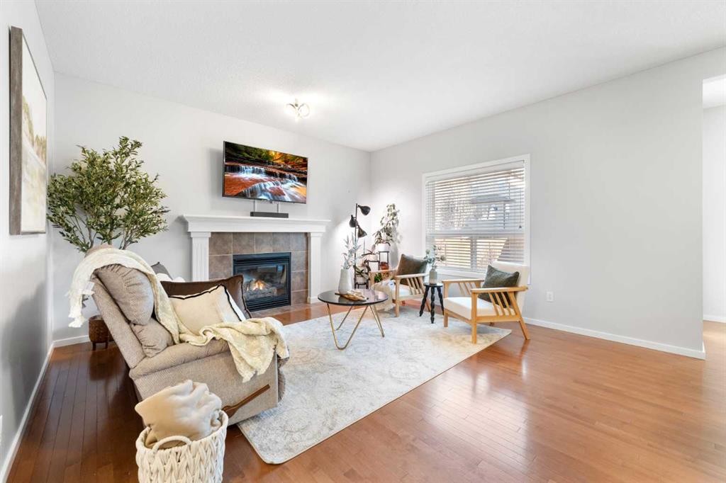 295 Prairie Springs Crescent Sw, Airdrie, AB - Indoor Photo Showing Living Room With Fireplace