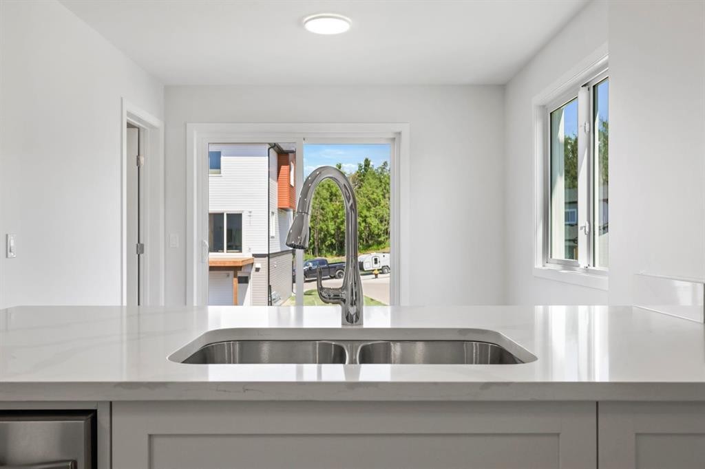 9 Park Lane, Didsbury, AB - Indoor Photo Showing Kitchen With Double Sink