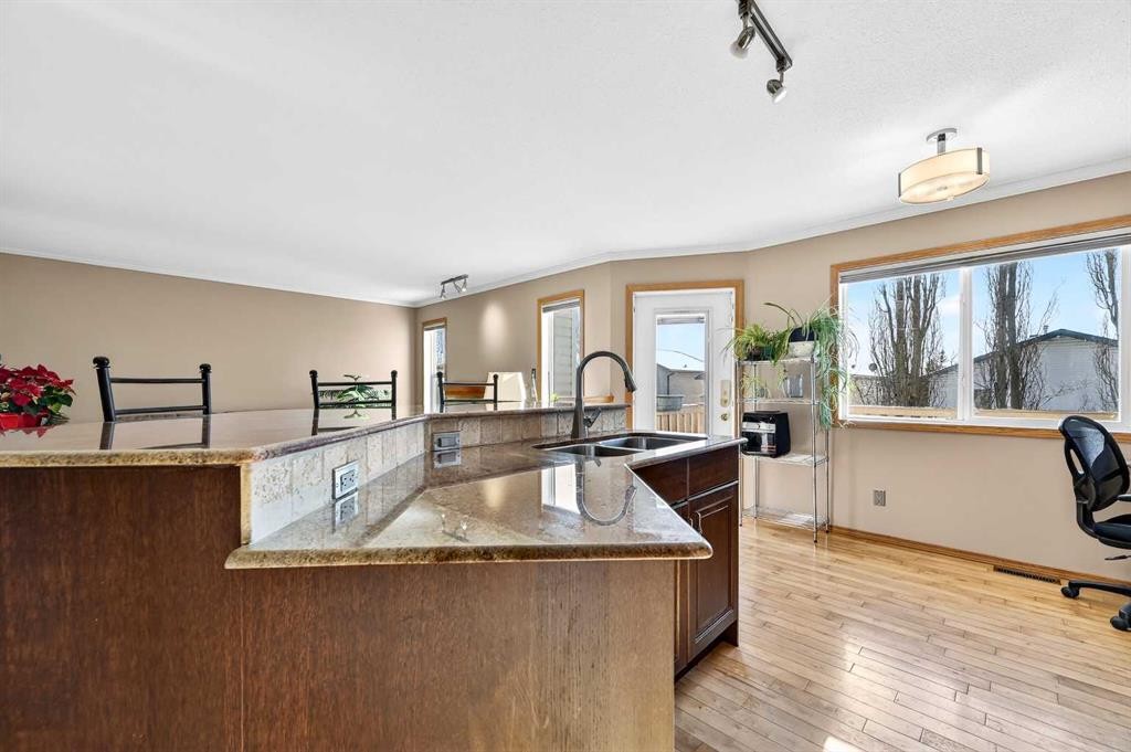 30 Tuscarora Way Nw, Calgary, AB - Indoor Photo Showing Kitchen With Double Sink