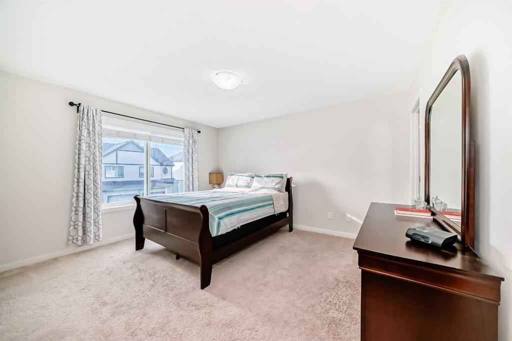 48 Copperpond Landing Se, Calgary, AB - Indoor Photo Showing Bedroom