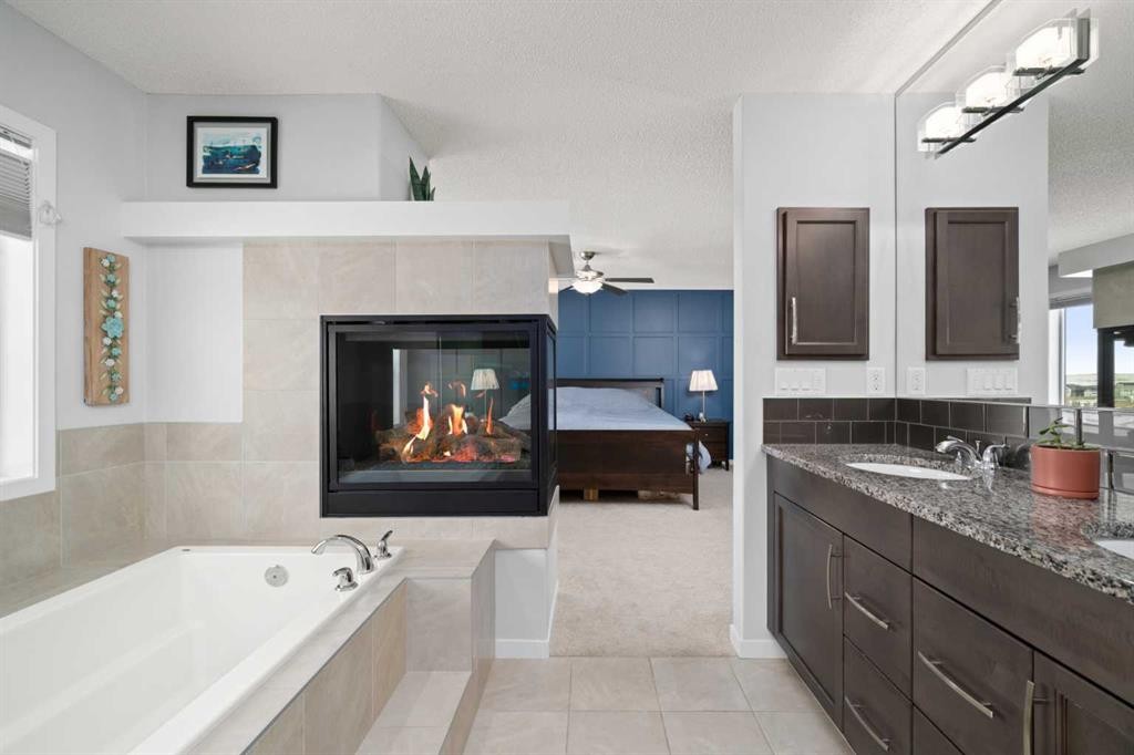 71 Nolanfield Crescent Nw, Calgary, AB - Indoor Photo Showing Bathroom With Fireplace