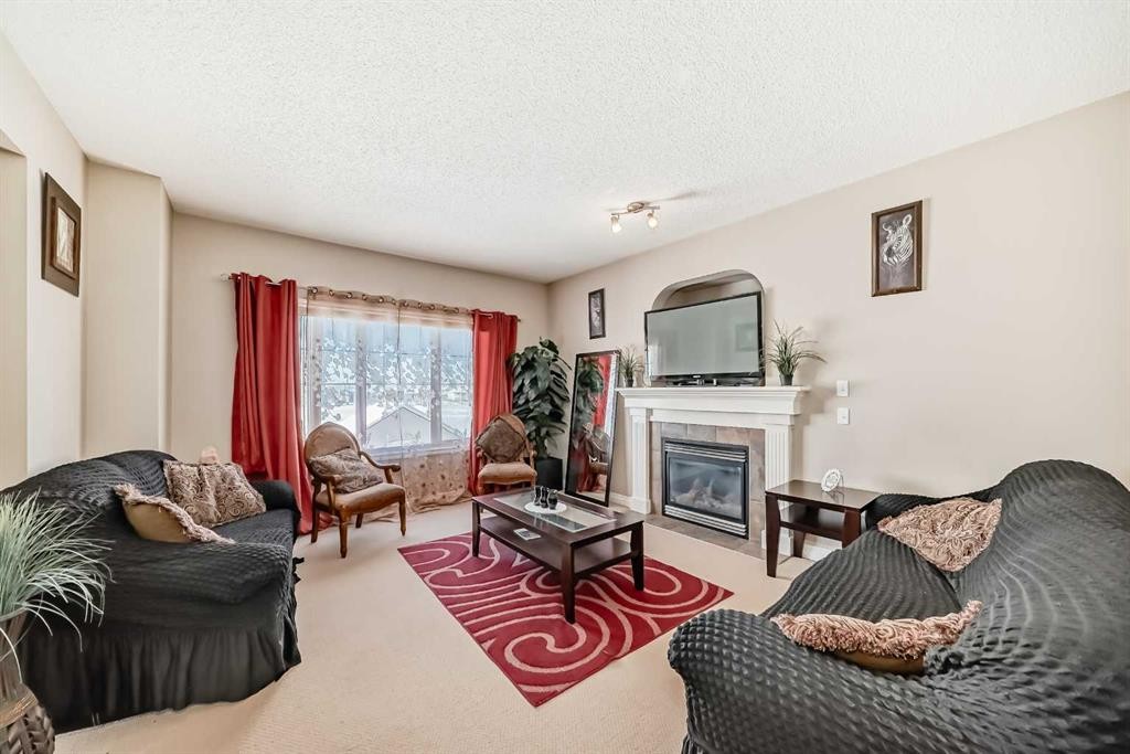 292 Taralake Terrace Ne, Calgary, AB - Indoor Photo Showing Living Room With Fireplace