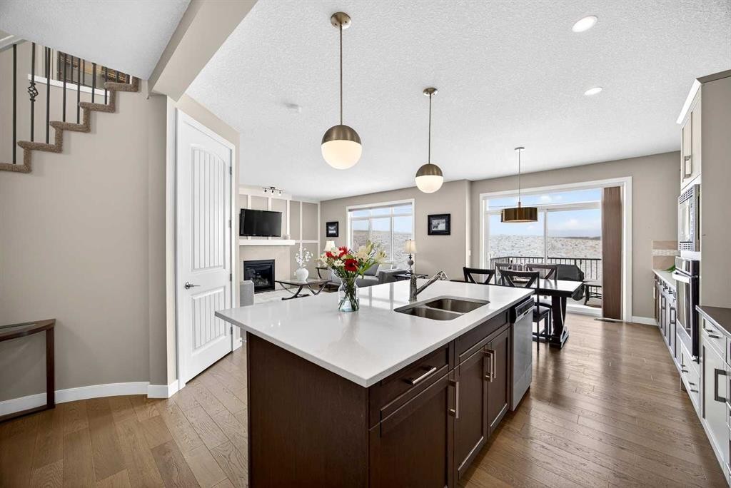144 Sundown View, Cochrane, AB - Indoor Photo Showing Kitchen With Double Sink