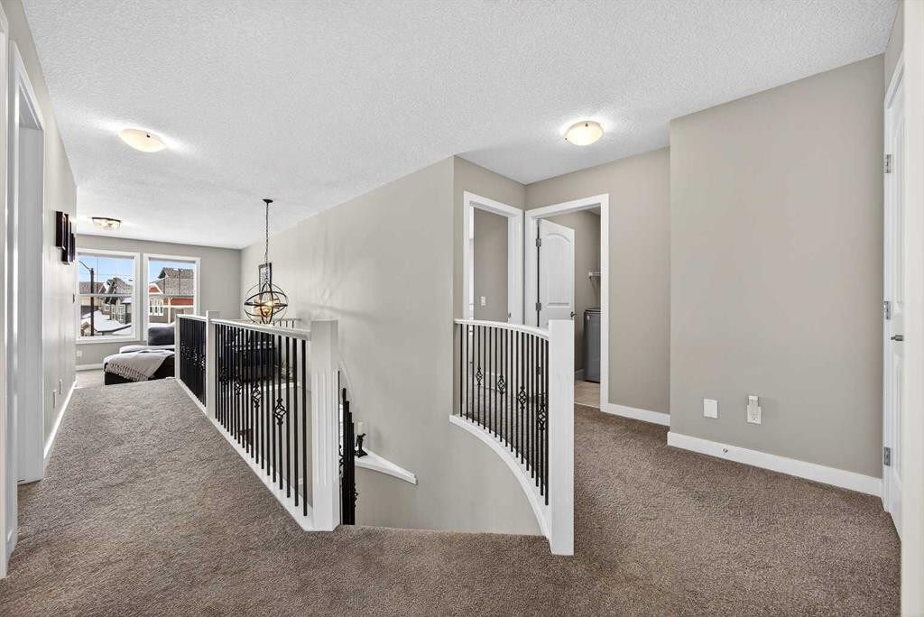 144 Sundown View, Cochrane, AB - Indoor Photo Showing Other Room