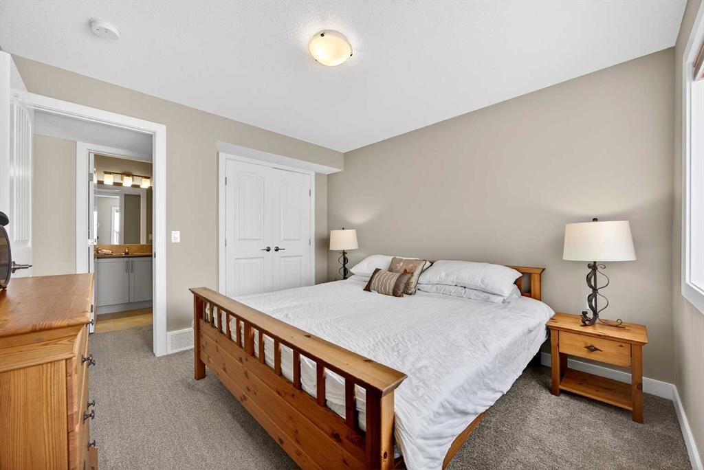 144 Sundown View, Cochrane, AB - Indoor Photo Showing Bedroom
