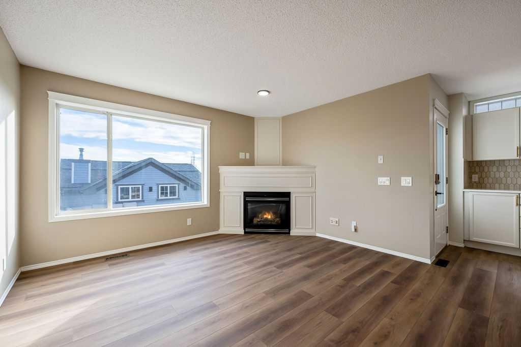 14 Tuscany Springs Rise Nw, Calgary, AB - Indoor Photo Showing Living Room With Fireplace