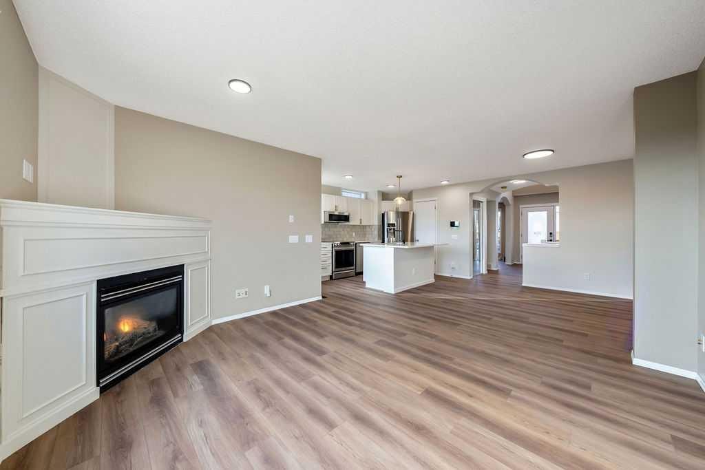 14 Tuscany Springs Rise Nw, Calgary, AB - Indoor Photo Showing Living Room With Fireplace
