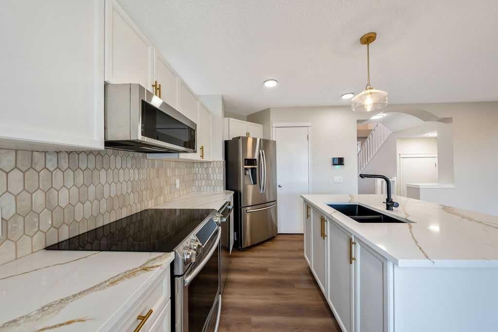 14 Tuscany Springs Rise Nw, Calgary, AB - Indoor Photo Showing Kitchen With Double Sink With Upgraded Kitchen