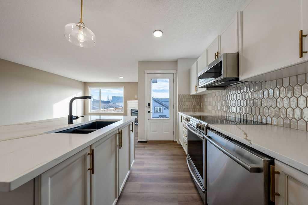 14 Tuscany Springs Rise Nw, Calgary, AB - Indoor Photo Showing Kitchen With Double Sink With Upgraded Kitchen