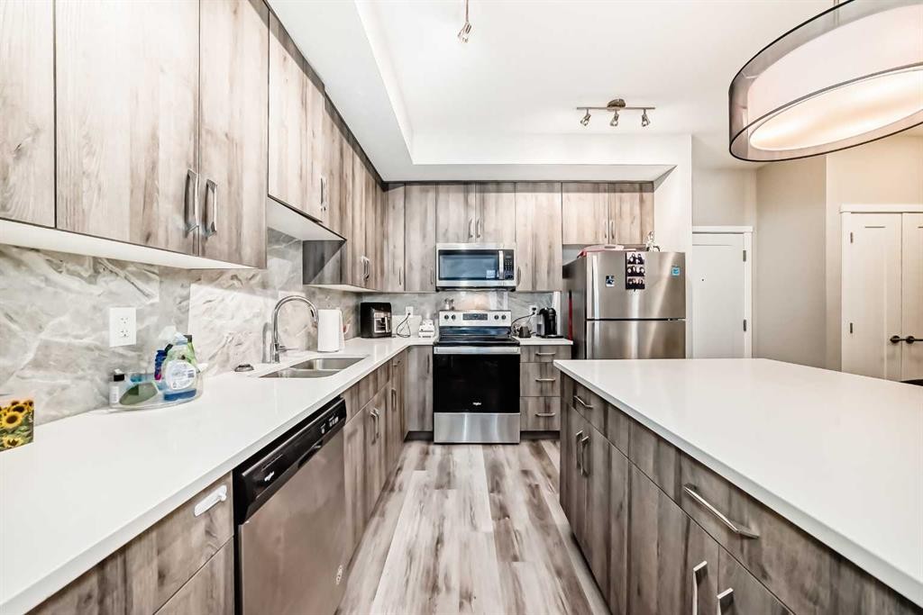 108-71 Shawnee Common Sw, Calgary, AB - Indoor Photo Showing Kitchen With Double Sink With Upgraded Kitchen