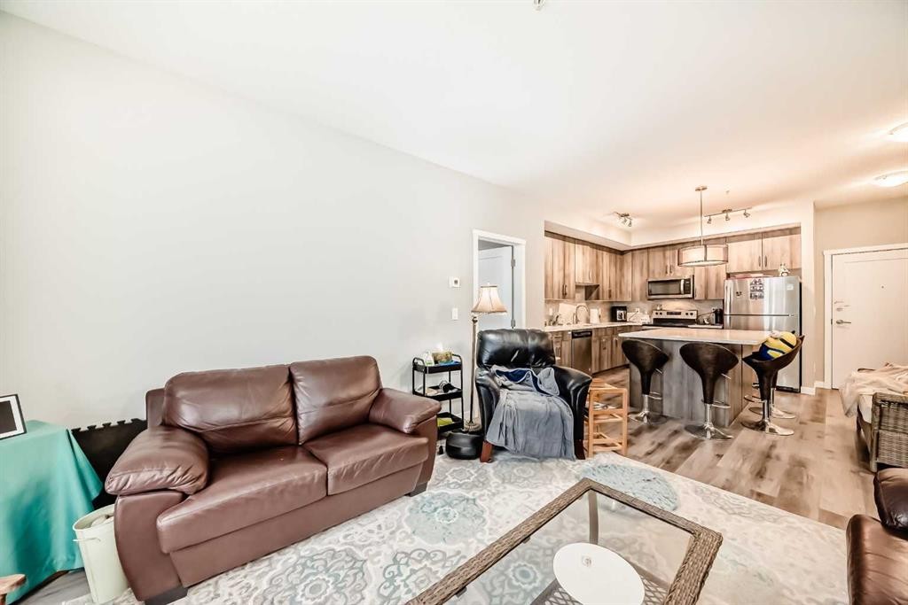 108-71 Shawnee Common Sw, Calgary, AB - Indoor Photo Showing Living Room