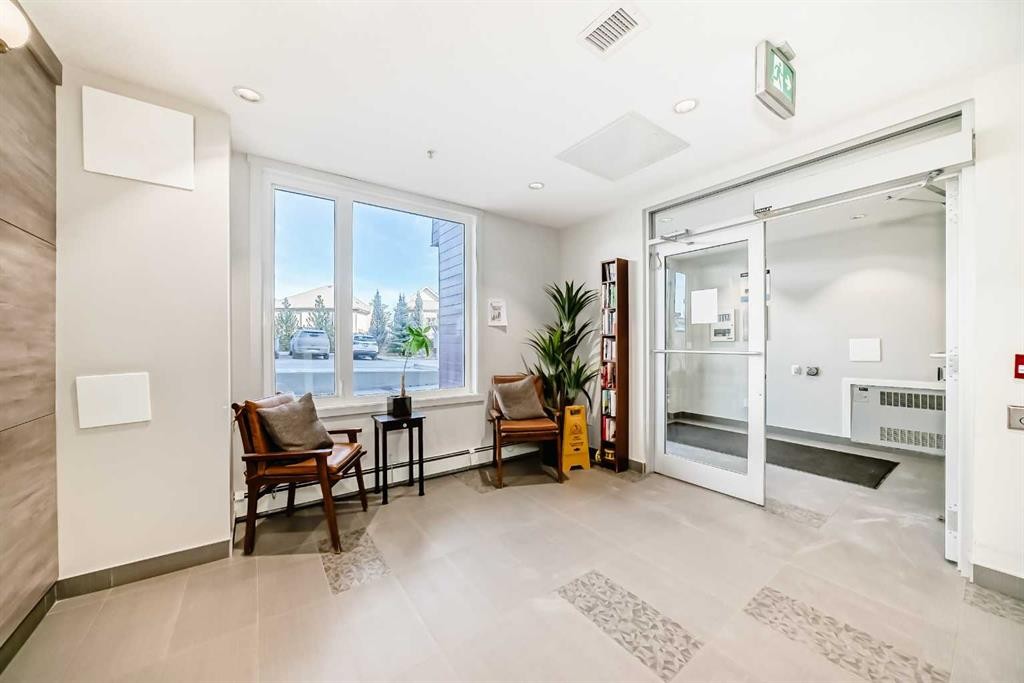 108-71 Shawnee Common Sw, Calgary, AB - Indoor Photo Showing Other Room