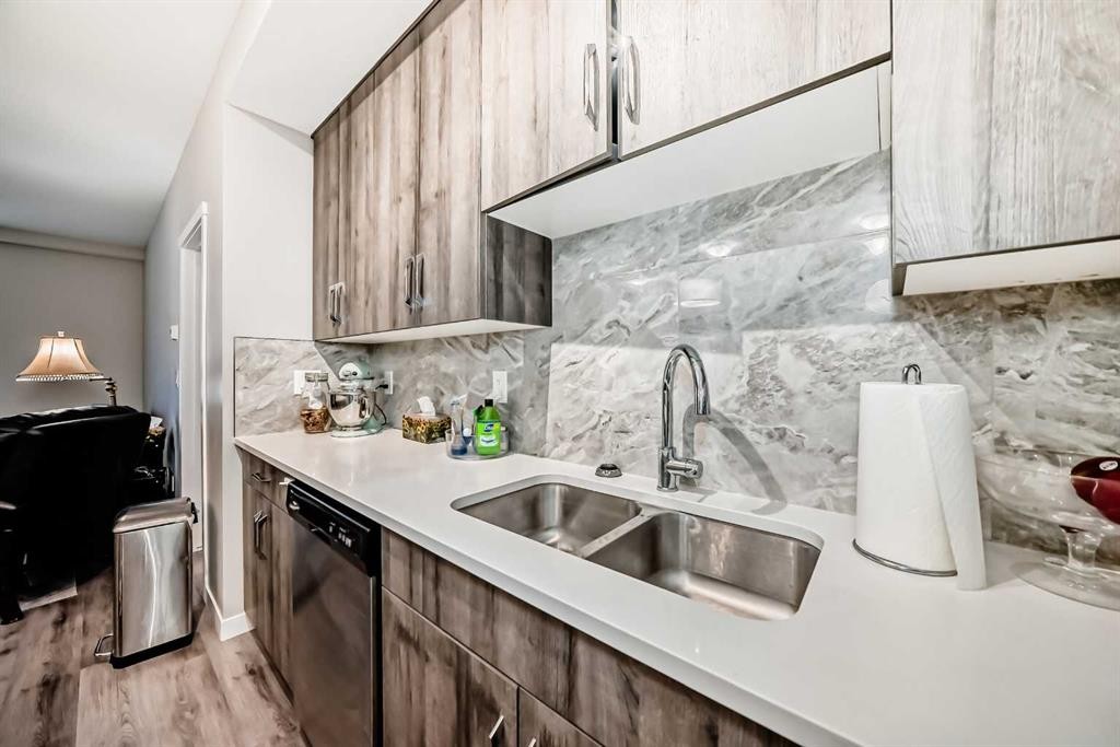 108-71 Shawnee Common Sw, Calgary, AB - Indoor Photo Showing Kitchen With Double Sink