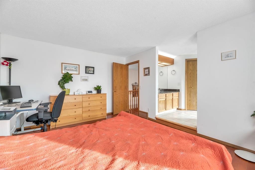 323 Hawkwood Boulevard Nw, Calgary, AB - Indoor Photo Showing Bedroom