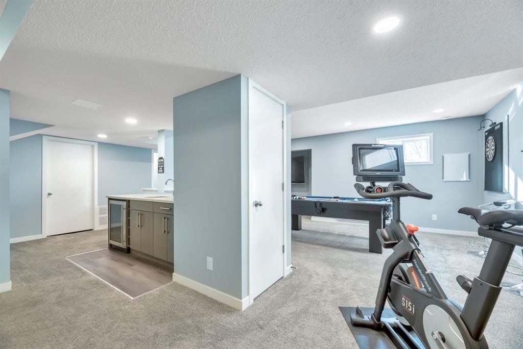 323 Hawkwood Boulevard Nw, Calgary, AB - Indoor Photo Showing Gym Room