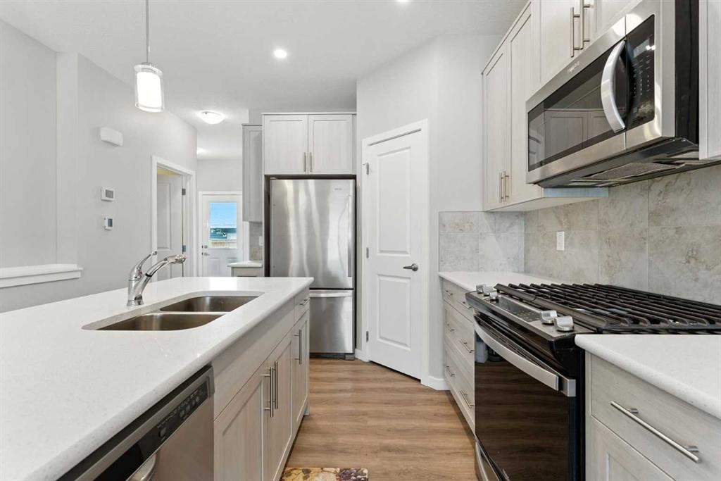 3644 Cornerstone Boulevard Ne, Calgary, AB - Indoor Photo Showing Kitchen With Stainless Steel Kitchen With Double Sink With Upgraded Kitchen