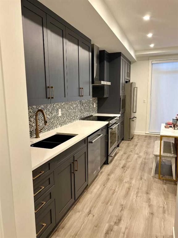 2115-200 Seton Circle Se, Calgary, AB - Indoor Photo Showing Kitchen With Double Sink With Upgraded Kitchen