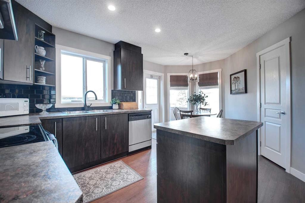 1606-2445 Kingsland Road Se, Airdrie, AB - Indoor Photo Showing Kitchen With Double Sink