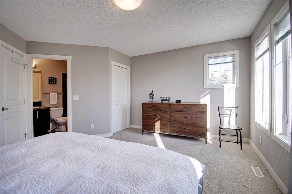 1606-2445 Kingsland Road Se, Airdrie, AB - Indoor Photo Showing Bedroom