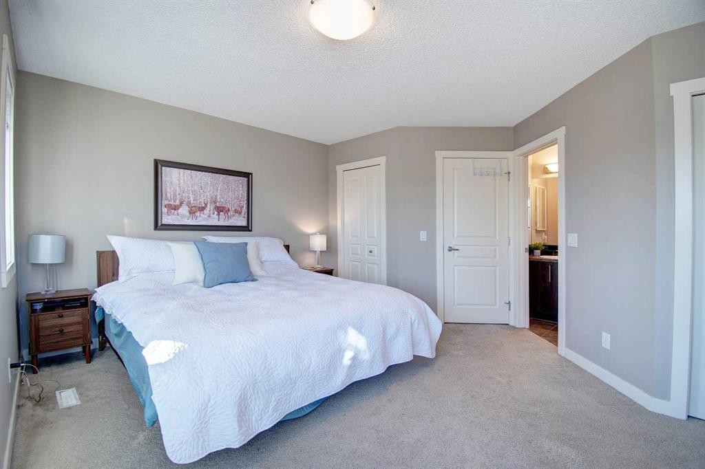 1606-2445 Kingsland Road Se, Airdrie, AB - Indoor Photo Showing Bedroom