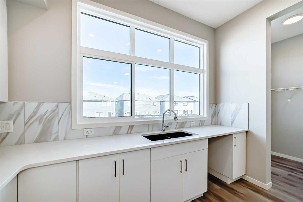 77 Mercado Landing Se, Calgary, AB - Indoor Photo Showing Kitchen With Double Sink