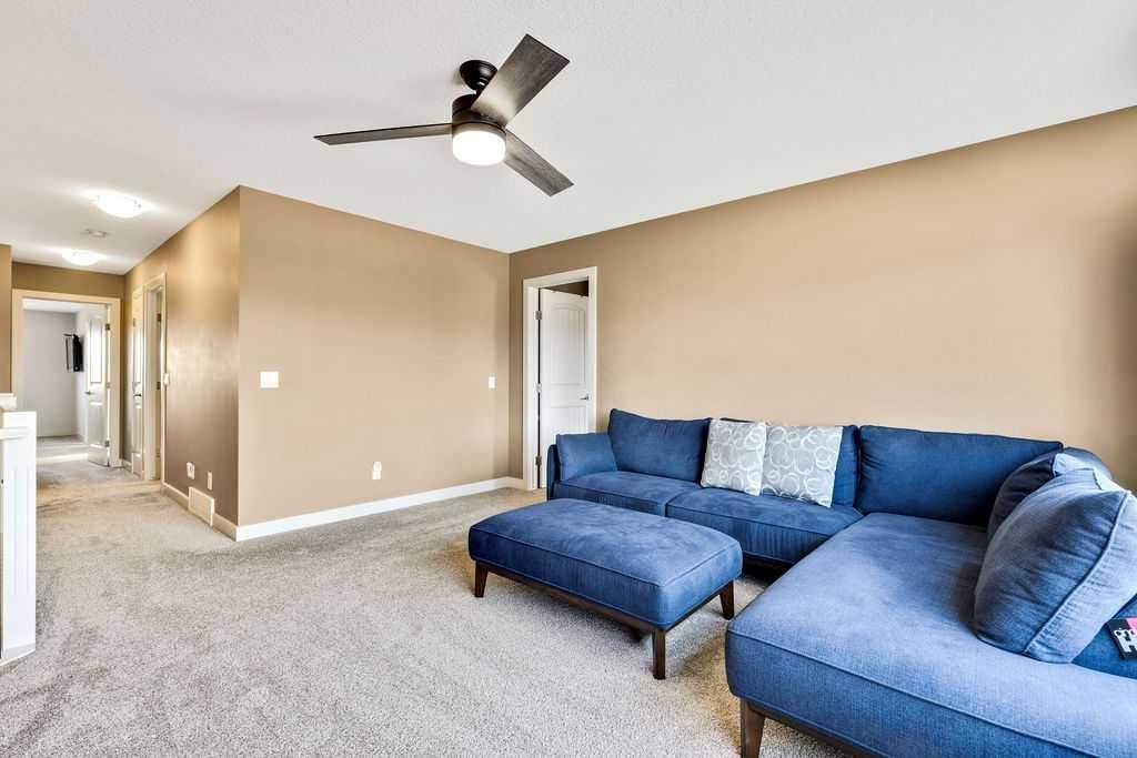 205 Aspenmere Way, Chestermere, AB - Indoor Photo Showing Living Room