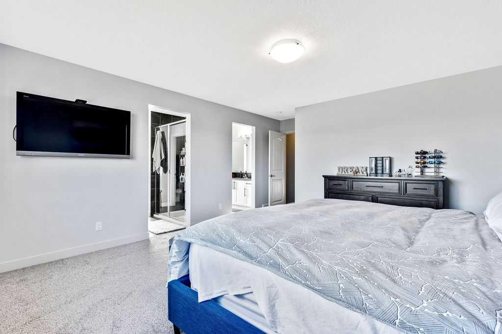 205 Aspenmere Way, Chestermere, AB - Indoor Photo Showing Bedroom
